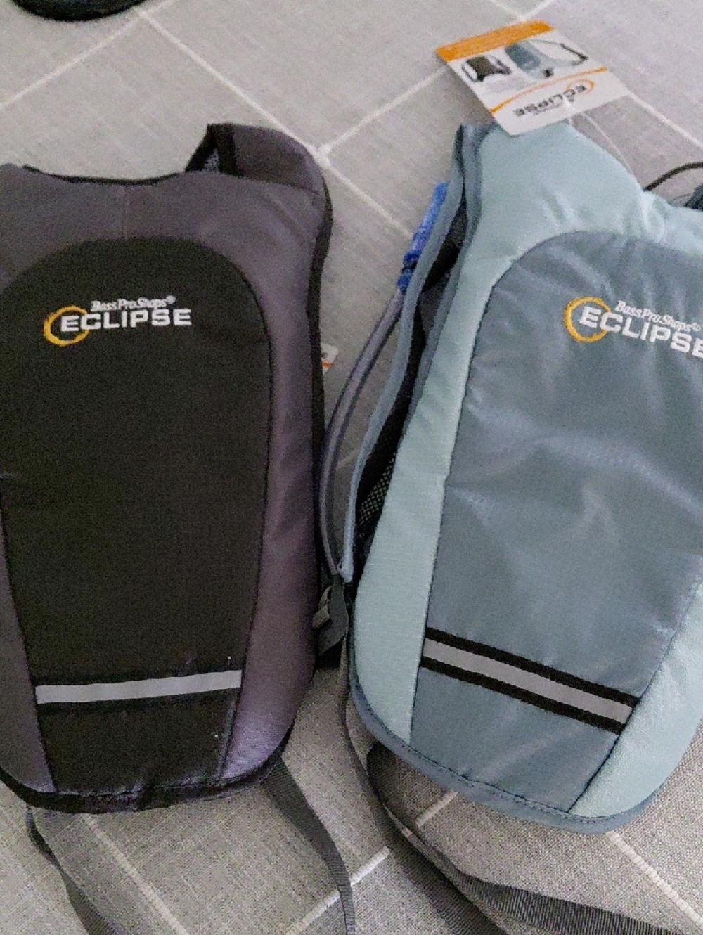 2 Bass Pro Shops 1 Black and 1 Blue Eclipse Hydration Pack.